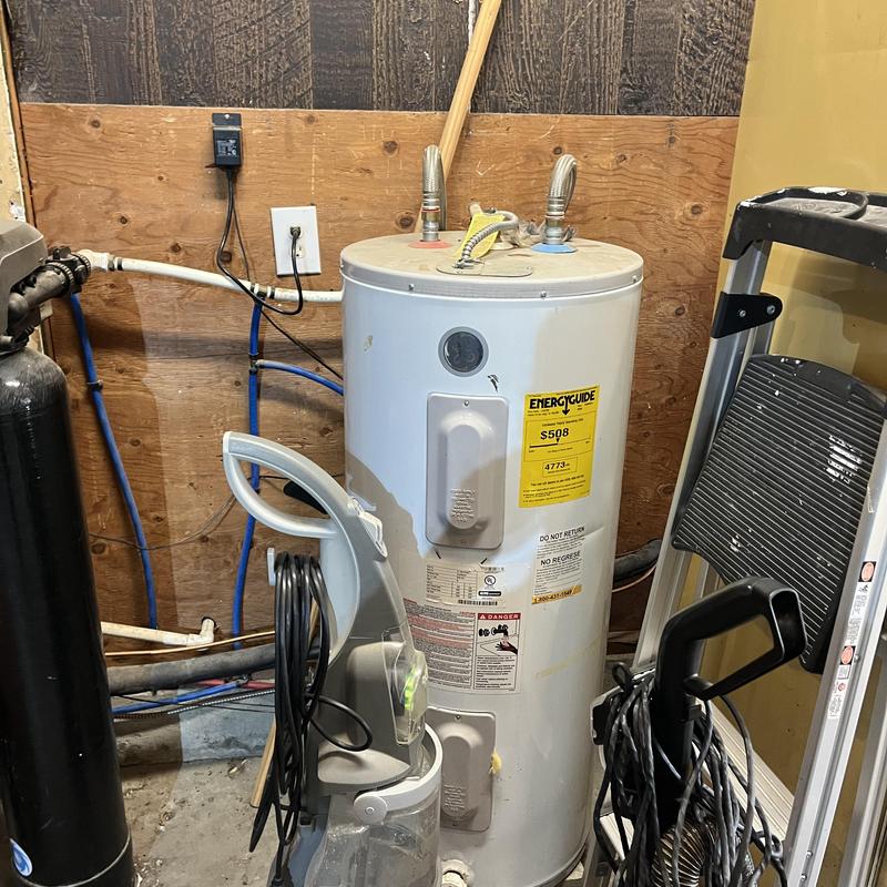 Water heater with attached filtration system and ladder nearby