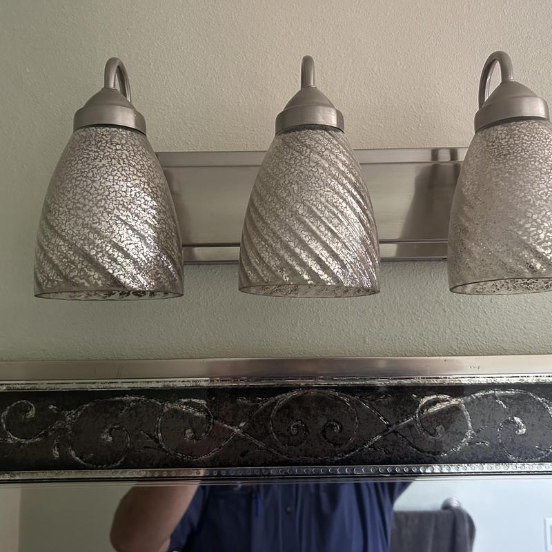 Vanity light fixture with textured glass shades