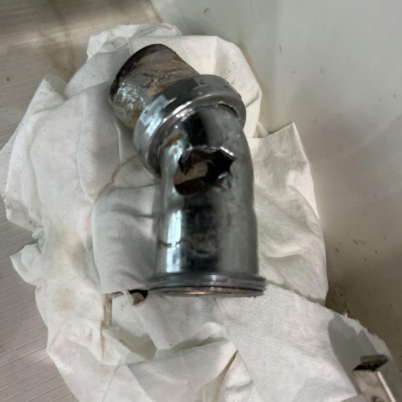 Kitchen sink drain line metal fitting with hole damage Kitchen sink drain line metal fitting with hole damage
