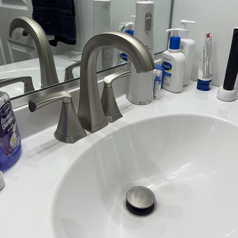 Vanity sink faucet with metal handles installed Vanity sink faucet with metal handles installed