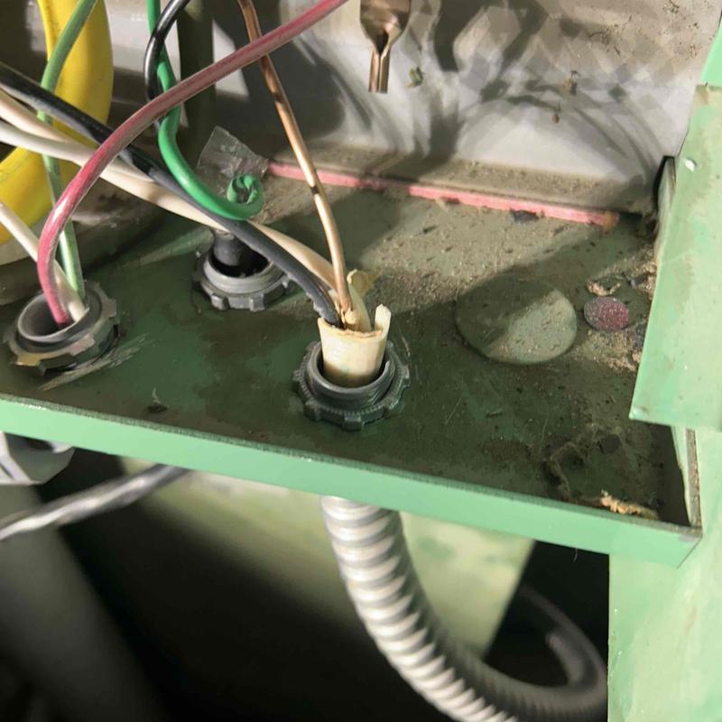 Electrical breaker panel wiring with damaged insulation