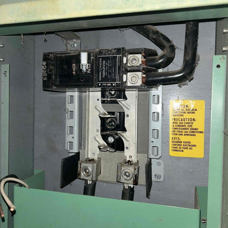 Electrical breaker panel with missing breakers and wiring