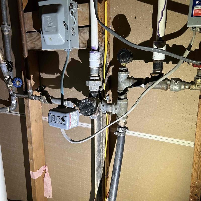 Water softener plumbing installation setup in basement