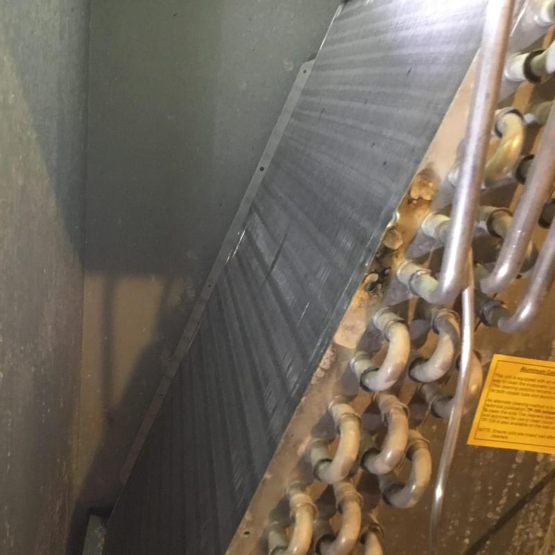 Furnace evaporator coil with rusted pipes and corrosion