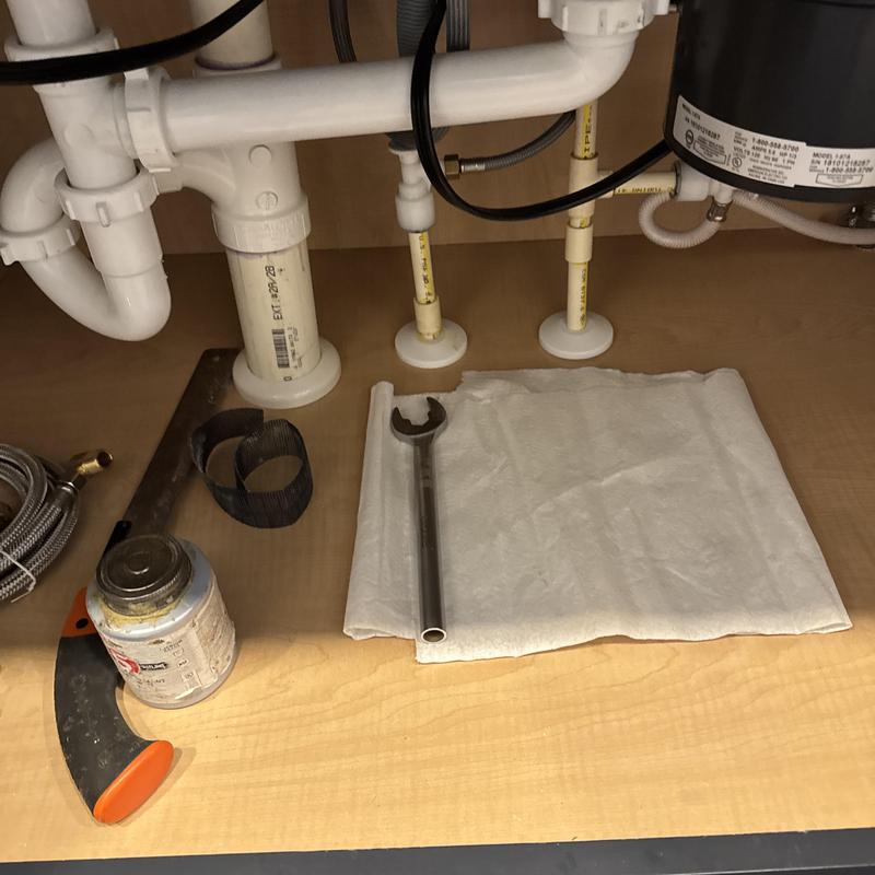 Push-pull shut off valves under kitchen sink with tools Push-pull shut off valves under kitchen sink with tools