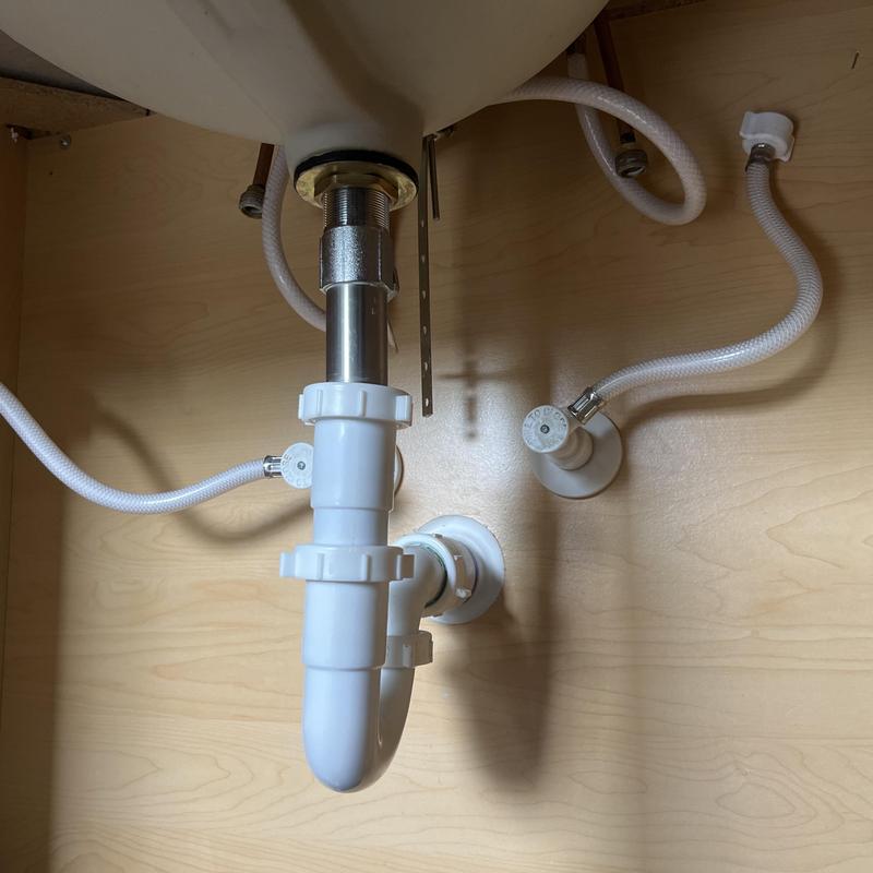 Vanity sink drain pipe with water supply lines under cabinet Vanity sink drain pipe with water supply lines under cabinet