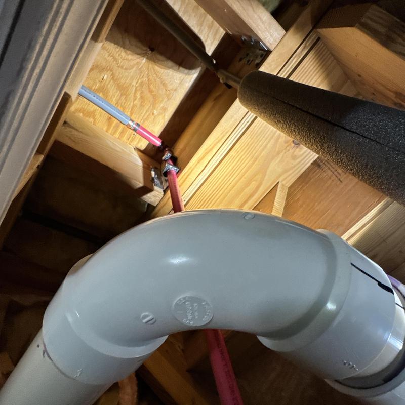 Hot water line with pipe insulation in attic space Hot water line with pipe insulation in attic space