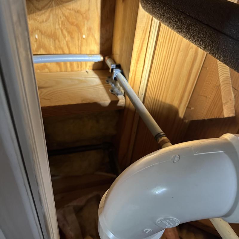 Hot water line pipe near water heater in wooden framing Hot water line pipe near water heater in wooden framing