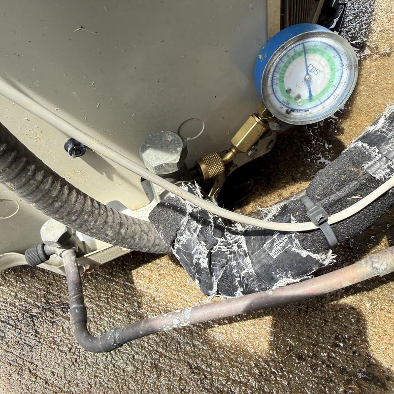 Refrigerant pressure gauge on HVAC copper tubing Refrigerant pressure gauge on HVAC copper tubing