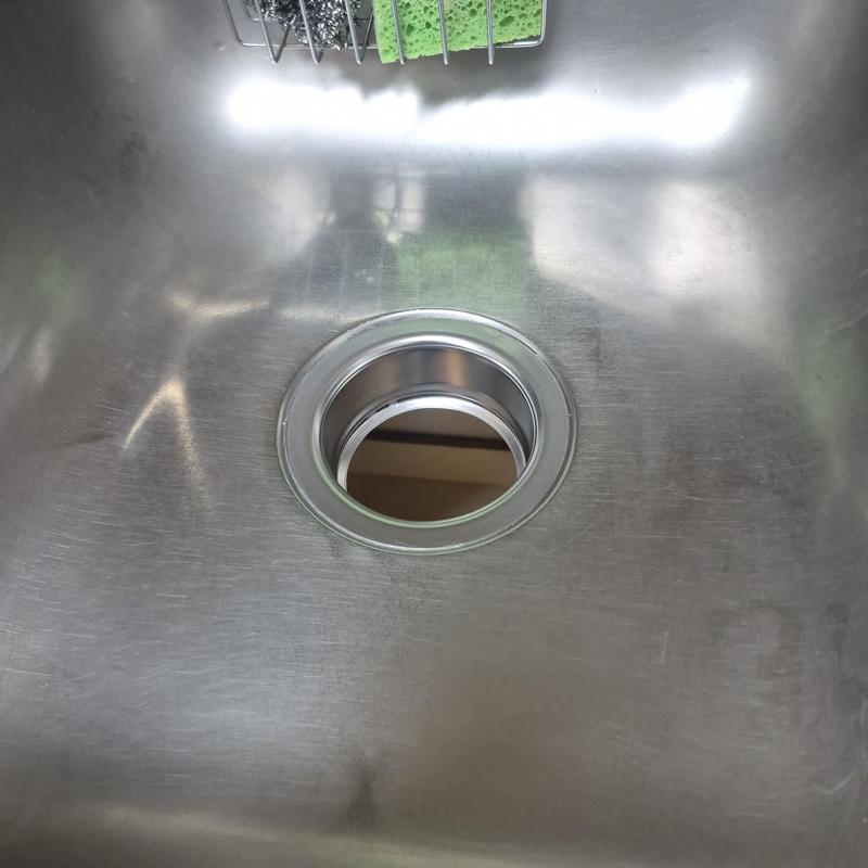 Garbage disposal sink opening with flange installed Garbage disposal sink opening with flange installed