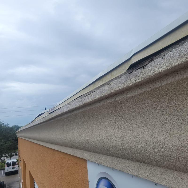 Commercial roof detail edge with repair work Commercial roof detail edge with repair work