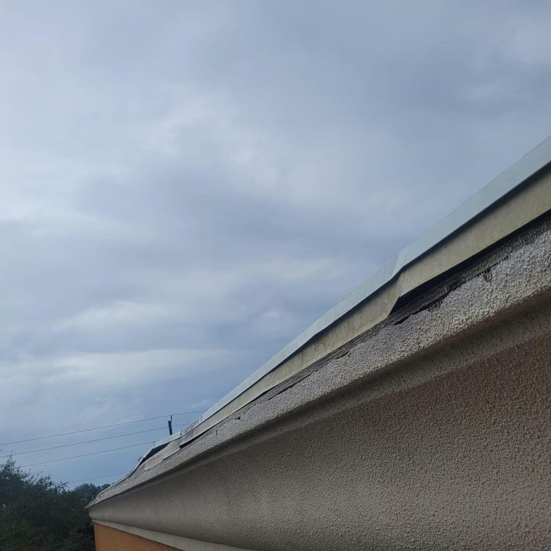 Commercial roof detail with worn flashing repairs Commercial roof detail with worn flashing repairs