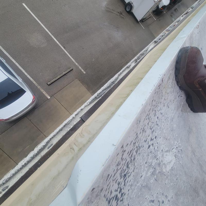Commercial roof edge detail with sealant failure Commercial roof edge detail with sealant failure