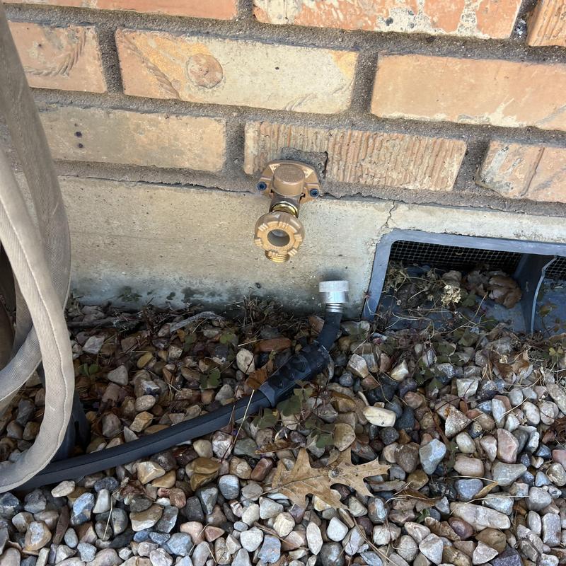 Woodford frost free hose bib on brick wall