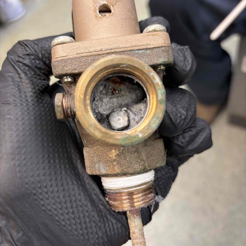 Boiler pressure relief valve with mineral buildup