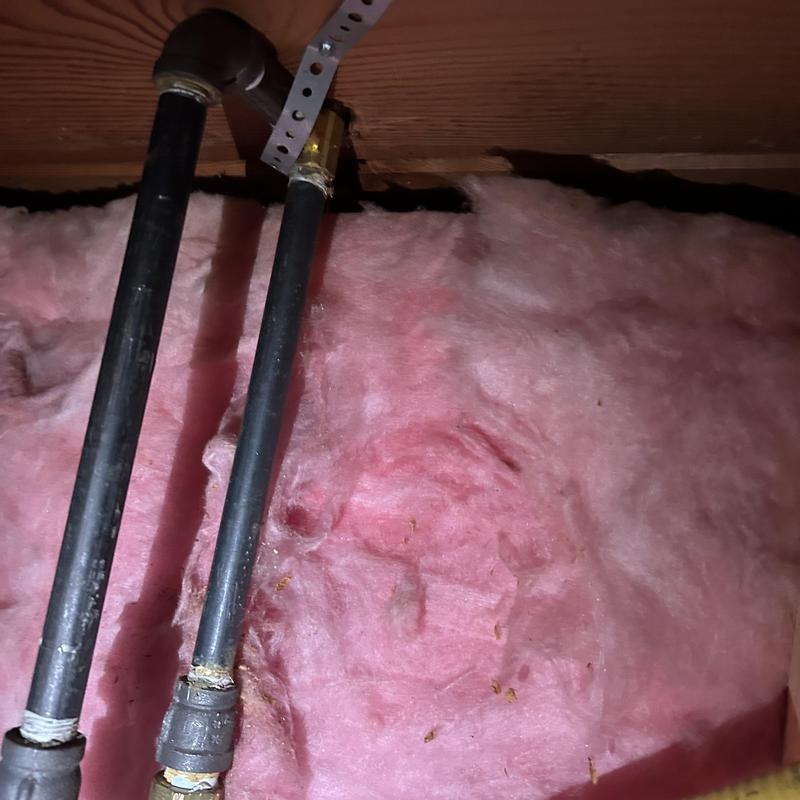 Gas valve and black iron piping with insulation background