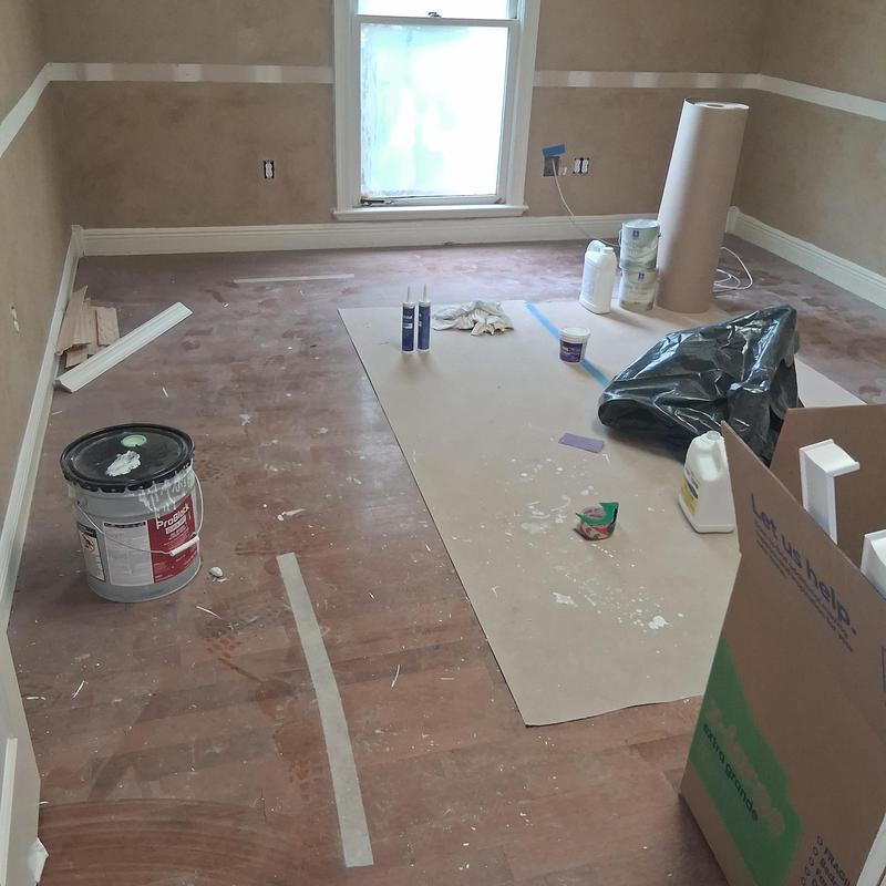 Hardwood flooring demo prep with tools and materials