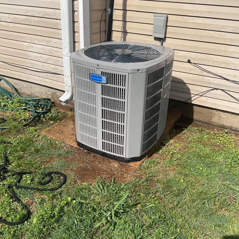 Condenser unit cleaning and maintenance on outdoor AC system