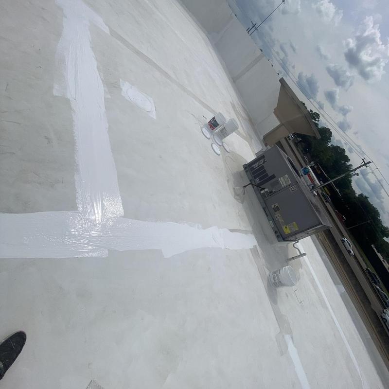 Roof membrane seams sealed with white roofing sealant