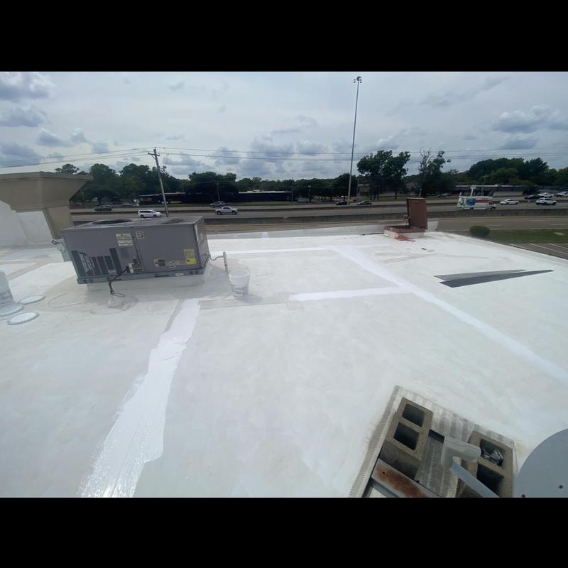 Roof seams with GAF high solids sealant on white roof