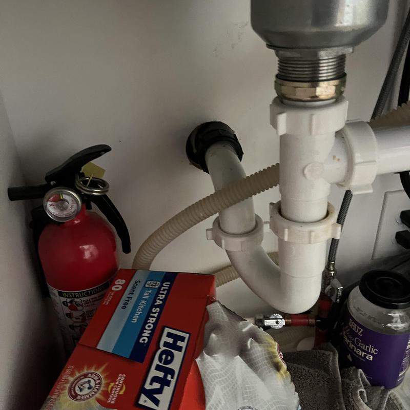Kitchen sink drain pipes and fittings under sink