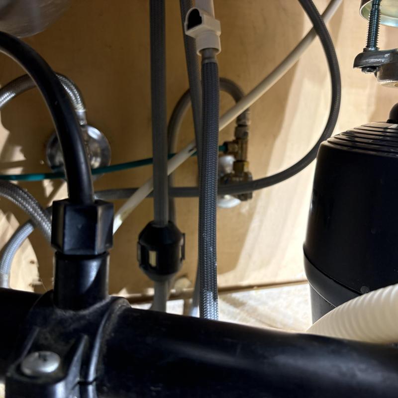 Garbage disposal unit and plumbing connections under sink Garbage disposal unit and plumbing connections under sink