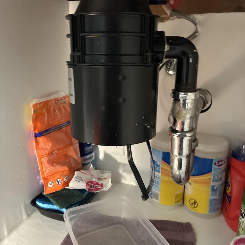 Garbage disposal and P-trap under kitchen sink Garbage disposal and P-trap under kitchen sink