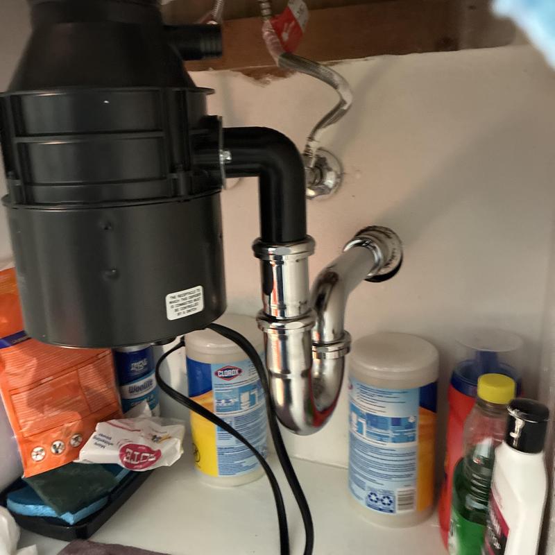 Garbage disposal and P-trap under kitchen sink Garbage disposal and P-trap under kitchen sink