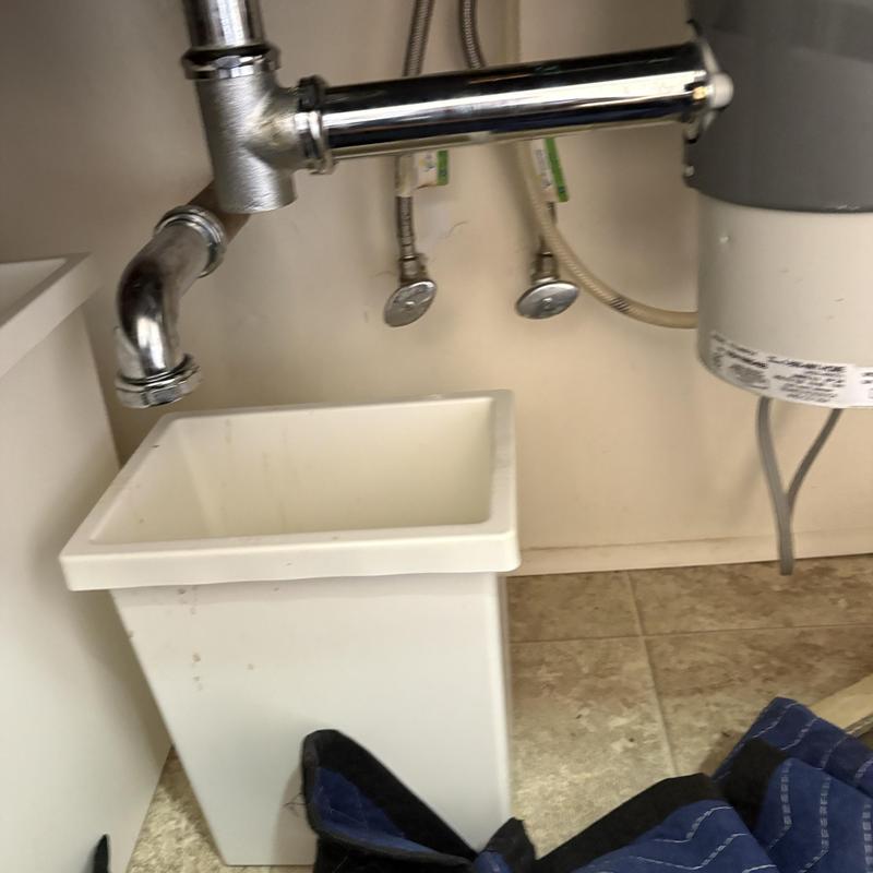 Drain tailpiece and fittings under kitchen sink Drain tailpiece and fittings under kitchen sink