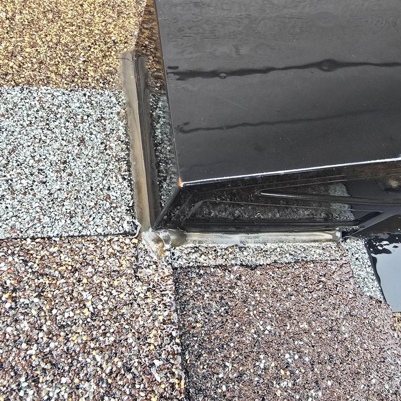Pipe jack flashing on shingle roof with sealant applied Pipe jack flashing on shingle roof with sealant applied