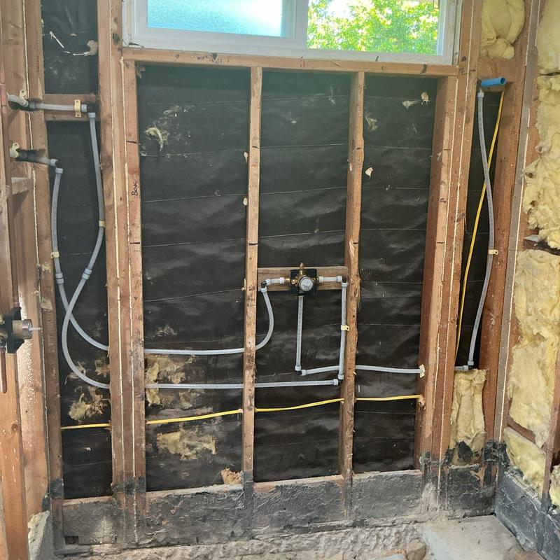 Shower valve installation with exposed plumbing studs