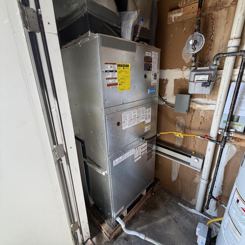 Magic Pak HVAC unit installation in utility closet