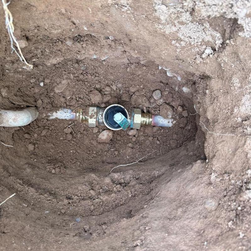 Pressure reducing valve installed on buried water main pipe