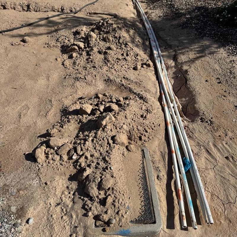 Water main excavation with pipes and access box in Queen Creek