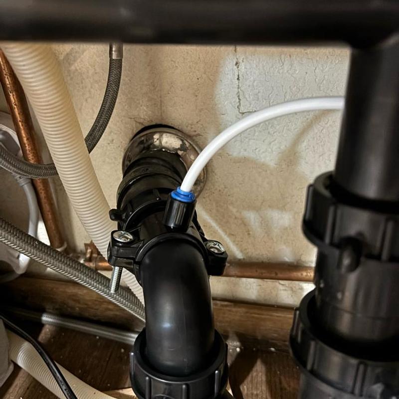 Kitchen drain pipe with RO saddle installation