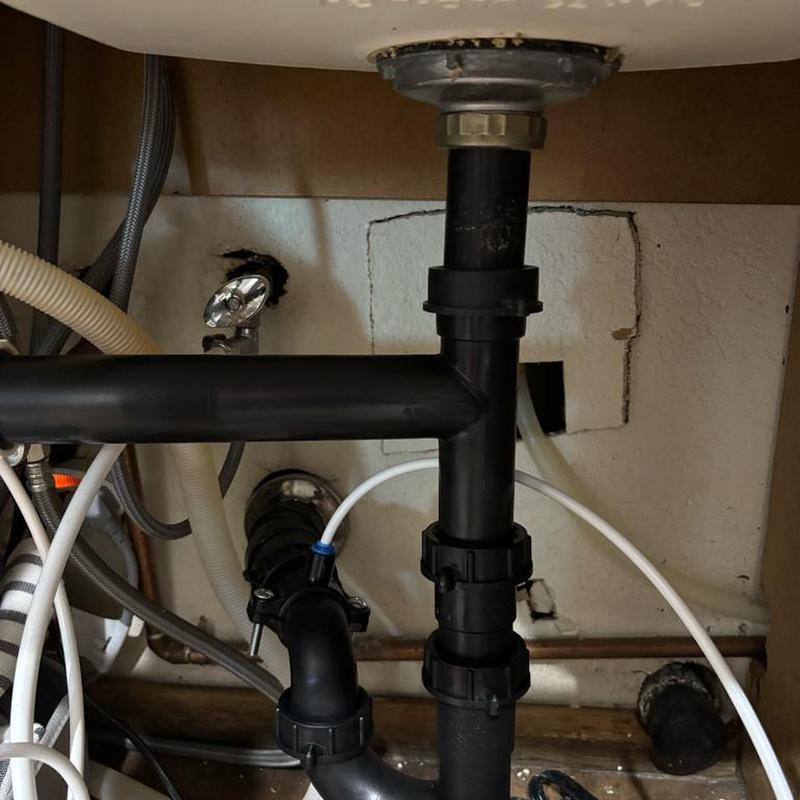 Kitchen drain pipes with new RO saddle installation