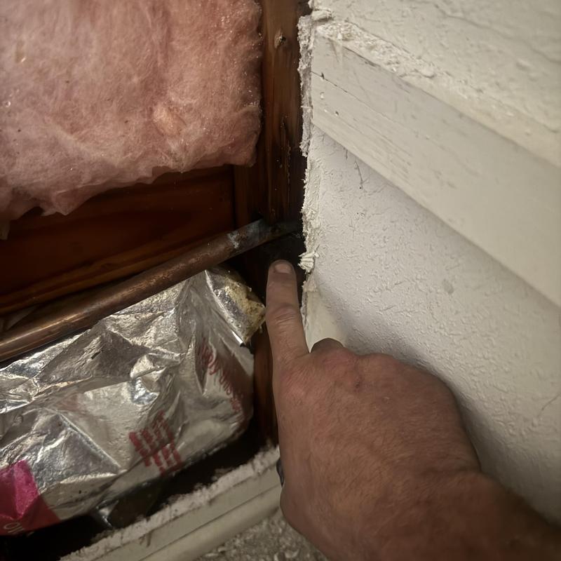 Copper plumbing pipe with pinhole leak inside wall cavity Copper plumbing pipe with pinhole leak inside wall cavity