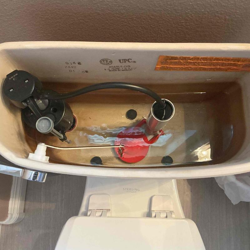 Toilet tank interior with flush valve and angle stop valve