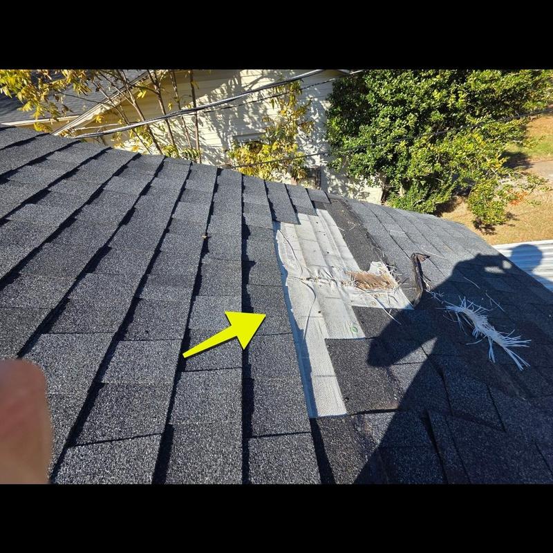 Asphalt shingle roof storm damage with temporary patch Asphalt shingle roof storm damage with temporary patch