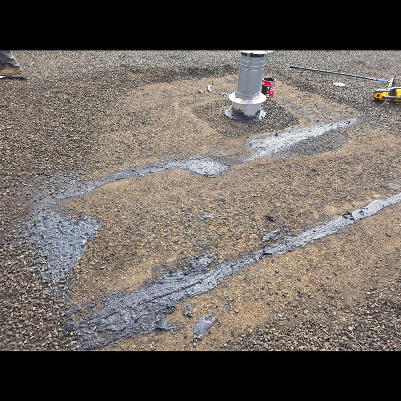 Roof vent flashing seal repair on gravel roof Roof vent flashing seal repair on gravel roof
