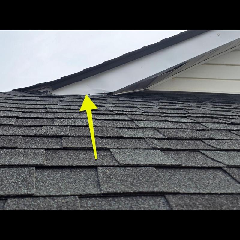 Roof shingles with damaged flashing near roof edge Roof shingles with damaged flashing near roof edge