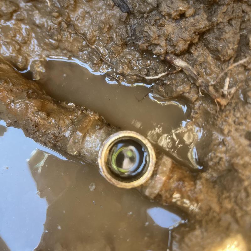 Irrigation shut off valve in muddy trench
