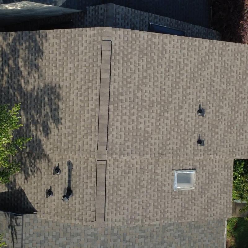 Asphalt shingle roof with vents and skylight inspection