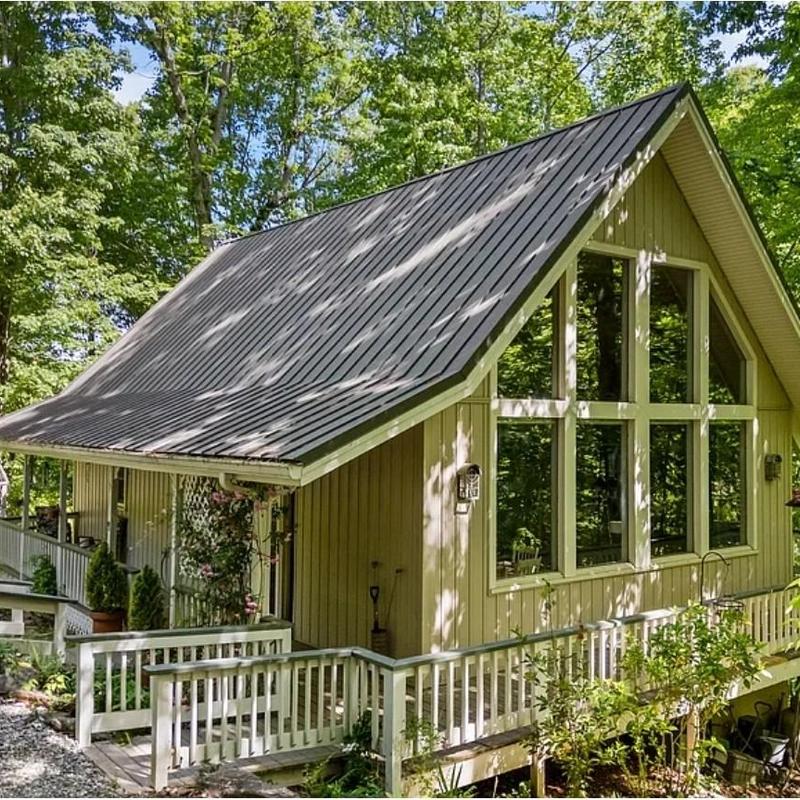 Metal standing seam roof on residential cabin