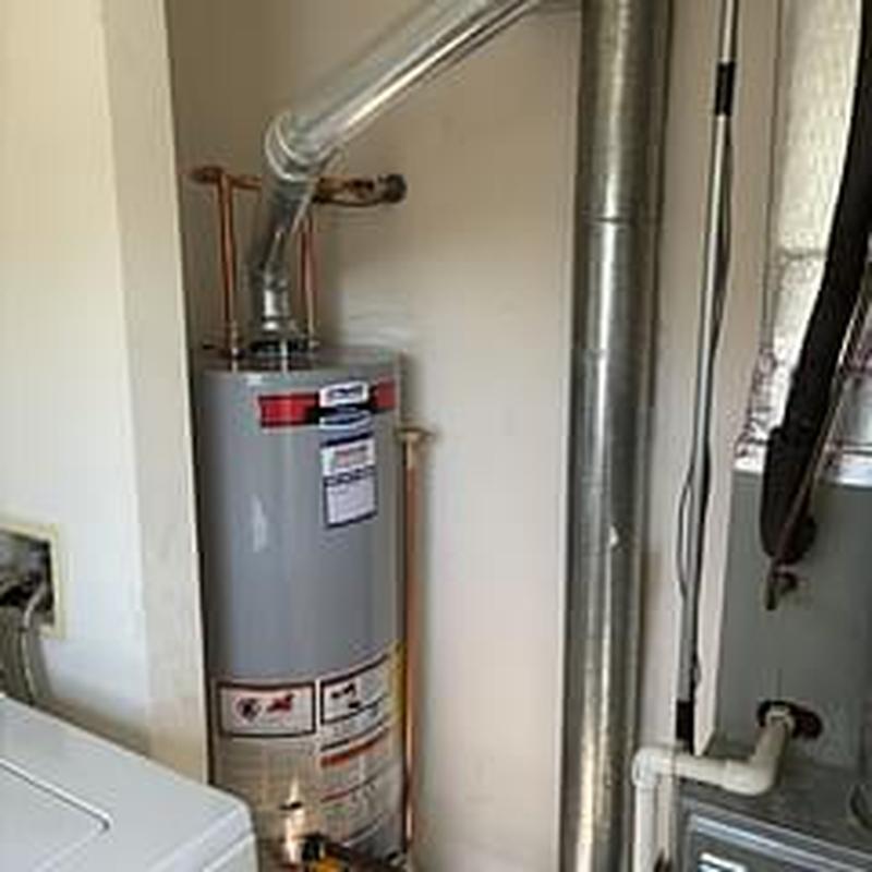 Natural gas water heater with aluminum pan installation