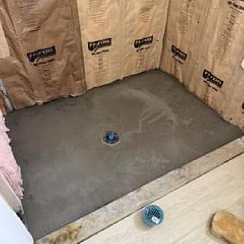 Shower pan installation with drain in framed shower area Shower pan installation with drain in framed shower area