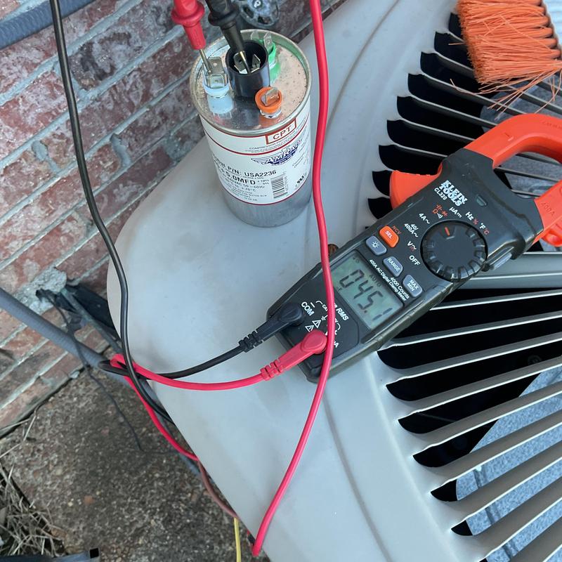 Blower capacitor testing on HVAC condenser unit