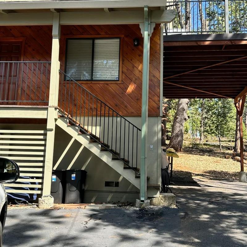 Steel seamless gutter with leaf blaster guard on cabin