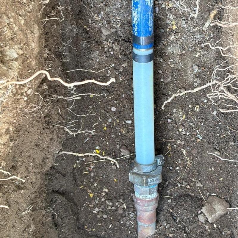 1 1/4 inch PEX water main with couplings in soil