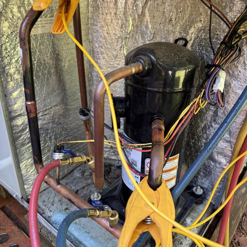 HVAC compressor with manifold gauges and wiring connections HVAC compressor with manifold gauges and wiring connections